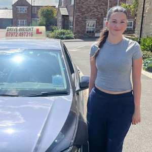Evie stood next to the Drive-Wright car